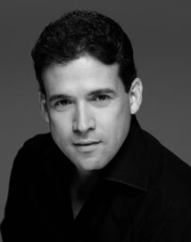 Black and white image of a man wearing black